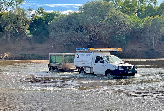 Wattnow car driving across a river to service remote communities